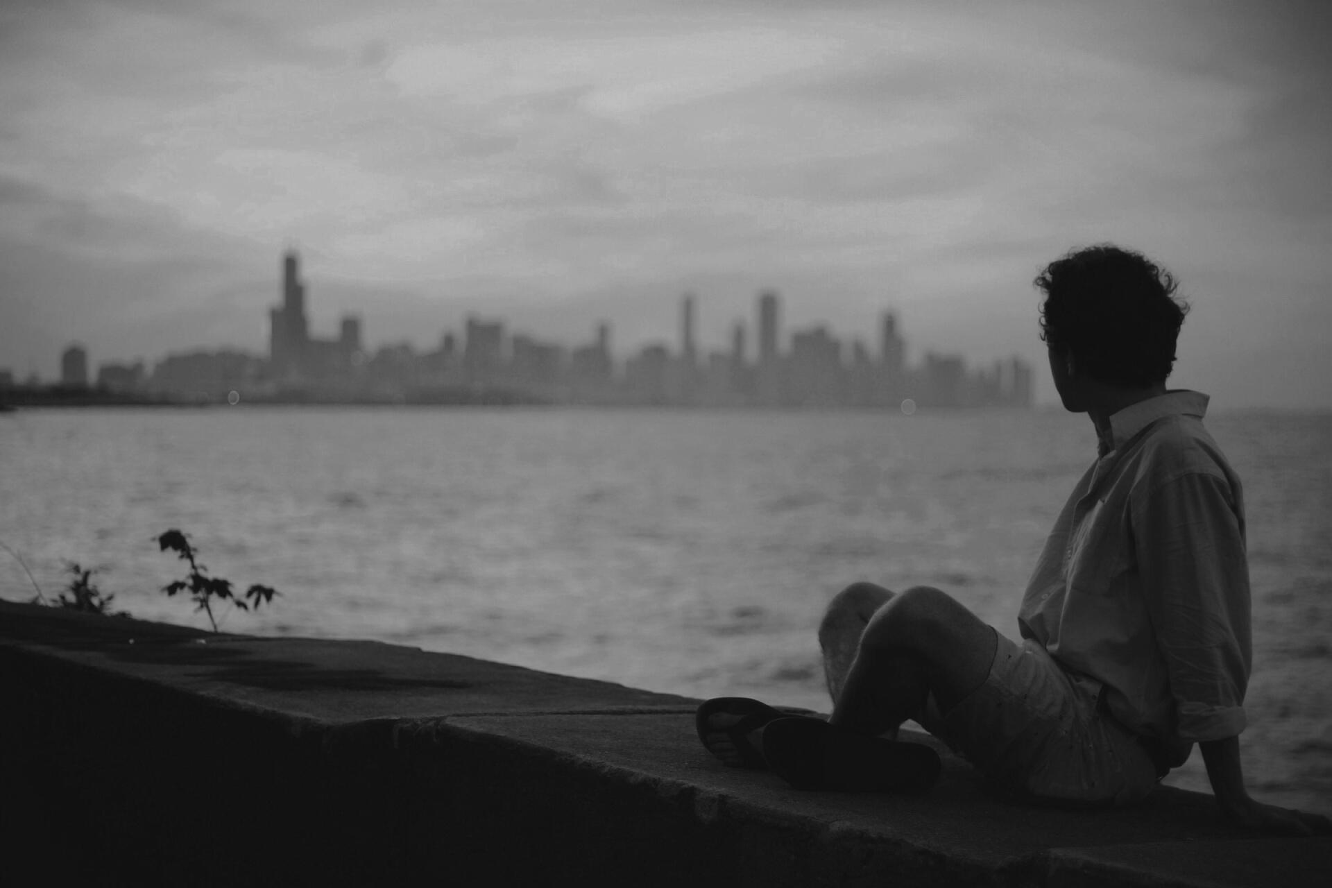 Is anybody in there? Picture of someone looking out over a city skyline
